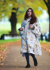 SNUGLFIT™ Hoodie Blanket - Kitten design worn outdoors, showcasing comfort and style.