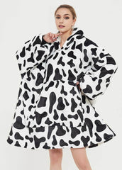 Cow print SNUGLFIT™ Hoodie Blanket for cozy comfort and style.