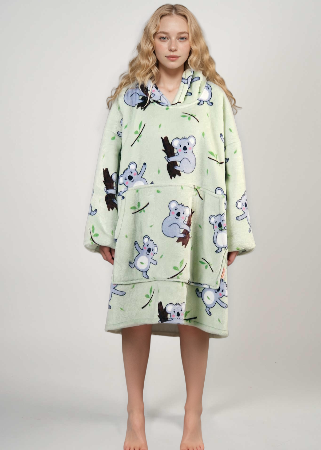 Hoodie blanket with koala print design for cozy warmth.