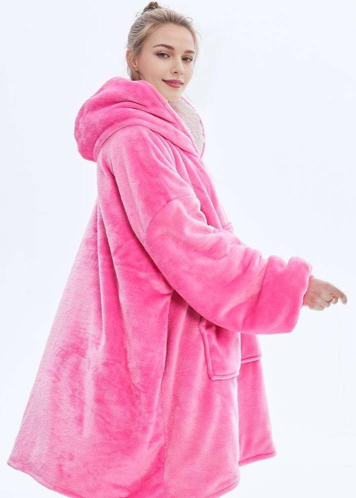 Hot pink SnuglFit™ hoodie blanket providing oversized comfort and warmth.