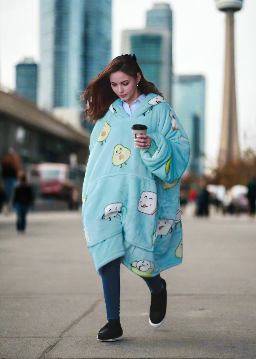 SNUGLFIT™ Avocado Hoodie Blanket worn outdoors, showcasing its oversized comfort and playful design.