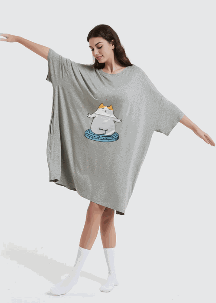 Snuglfit™ Oversized Zen Cat Sleep Tee in bamboo fabric, featuring a relaxed fit on a model with arms outstretched.