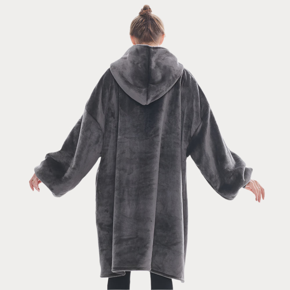 Smokey grey SnuglFit™ hoodie blanket worn by a person, showcasing its plush, oversized design for ultimate comfort and warmth.