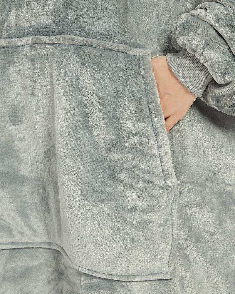 Light grey SNUGLFIT™ Hoodie Blanket with plush fleece and large front pocket.