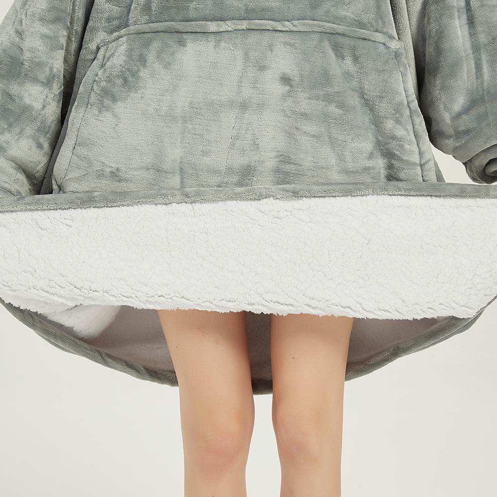 Light grey SNUGLFIT™ hoodie blanket with soft Sherpa fleece interior and large front pocket for cozy comfort.