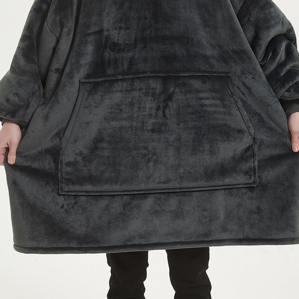 Hoodie blanket with oversized design in smokey grey, featuring large front pocket and plush Sherpa fleece.