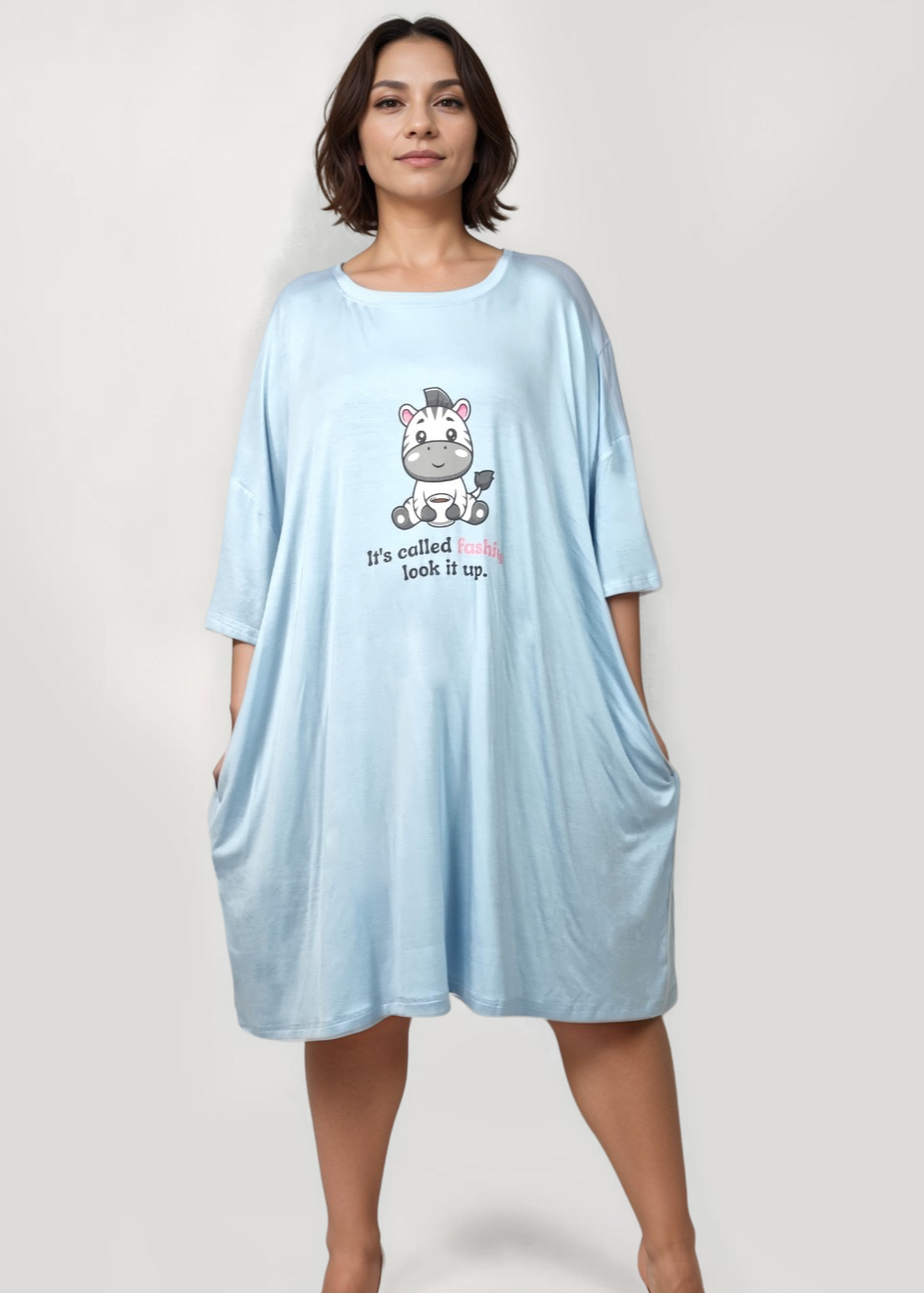 Oversized zebra-themed bamboo sleep tee with pockets, moisture-wicking fabric, and "It's called fashion, look it up" motif.