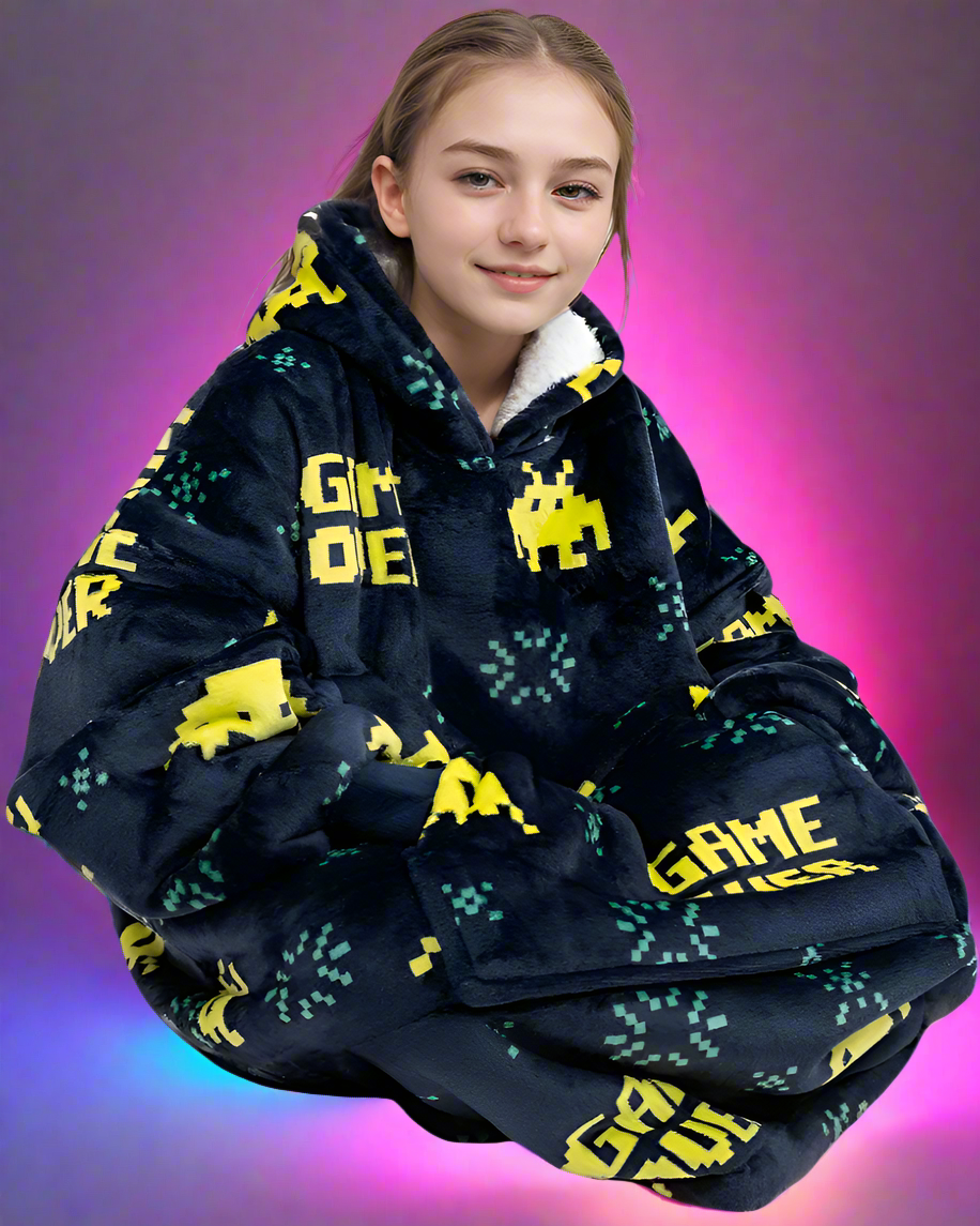Kid wearing SNUGLFIT™ Gamer Hoodie Blanket, cozy and oversized for comfort.
